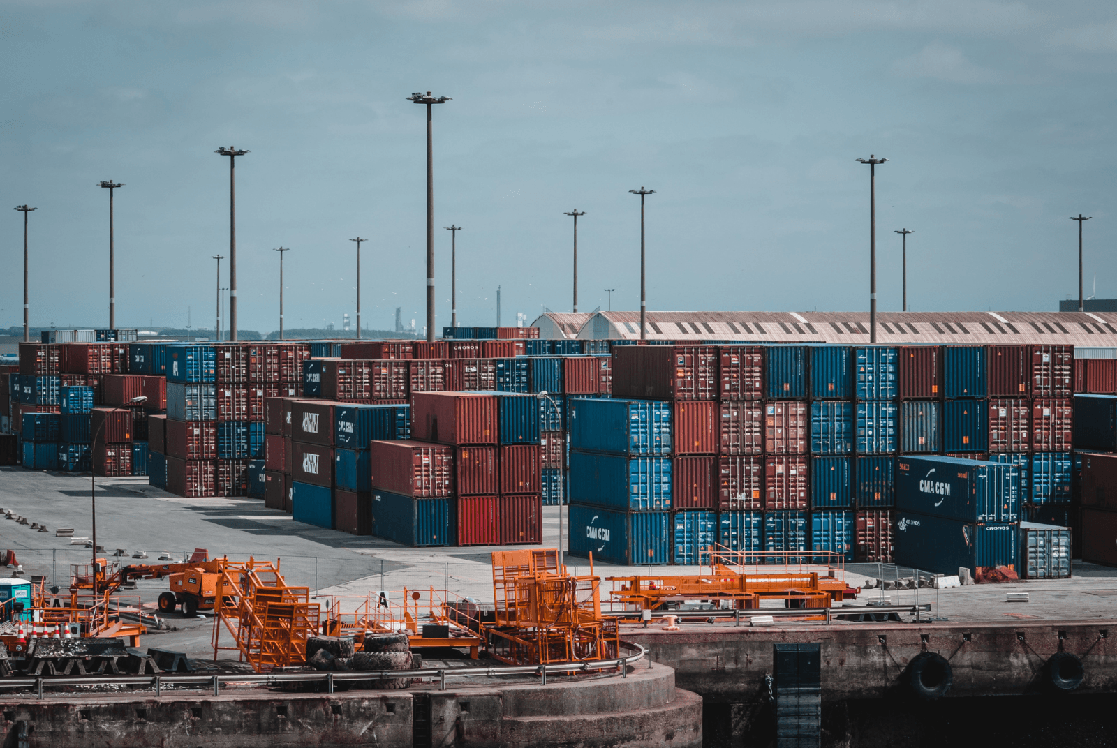Shipping container terminal with stacked containers at a port